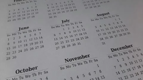 Marking July date on the calendar Stock Footage 311439679