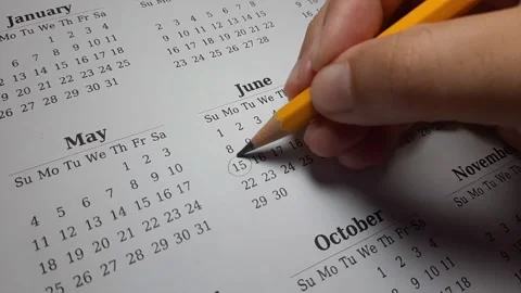 Marking the june 15 date on the calendar Stock Footage 303991601