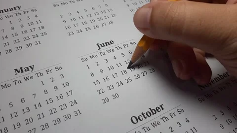 Marking the june 19 date on the calendar Stock Footage 303991606