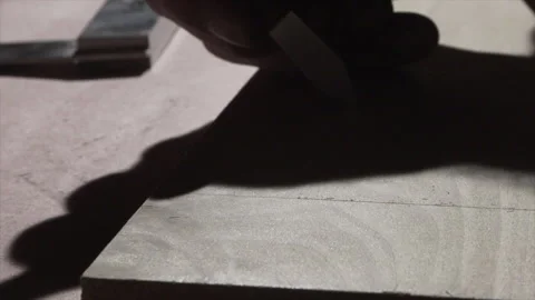 Marking knife scribing a cut line along a steel rule on a board (part 1) Video stock 346255735