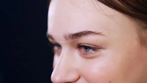 Marking the lines for the future brow line with the help of a thread. Video stock 243860825