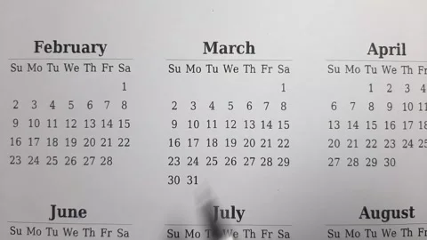 Marking march date on the calendar Stock Footage 296143524