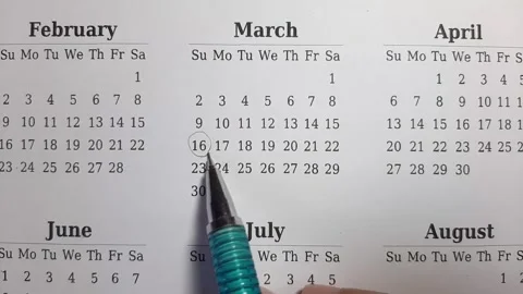 Marking march date on the calendar Stock Footage 296143528