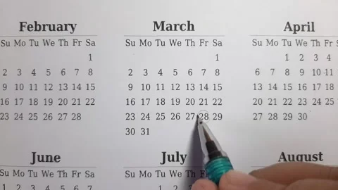 Marking march date on the calendar Stock Footage 296143545