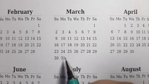 Marking march date on the calendar Stock Footage 296143549