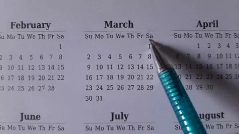 Marking march date on the calendar Stock Footage 296143550