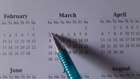 Marking march date on the calendar Stock Footage 296143551