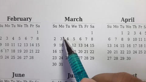 Marking march date on the calendar Stock Footage 296143552