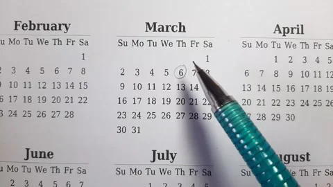 Marking march date on the calendar Stock Footage 296143556
