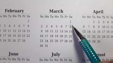 Marking march date on the calendar Stock Footage 296143557