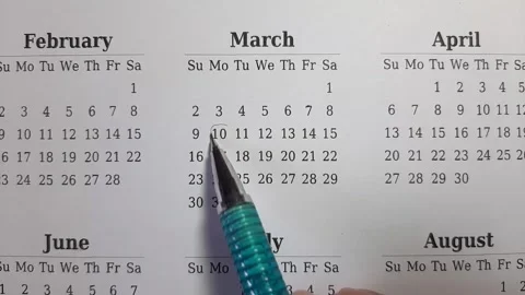Marking march date on the calendar Stock Footage 296143561