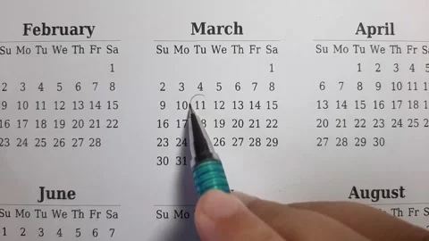 Marking march date on the calendar Stock Footage 296143562
