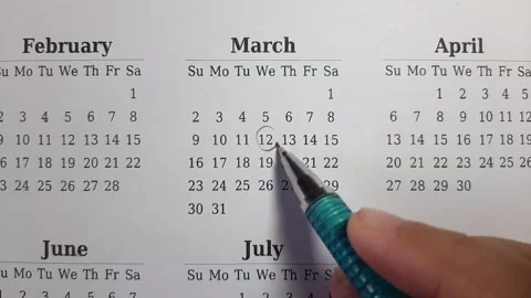 Marking march date on the calendar Video stock 296143564
