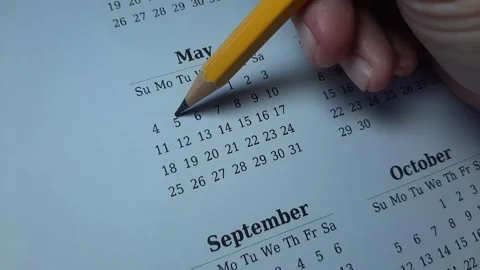 Marking the may 5 date on the calendar Stock Footage 303991600