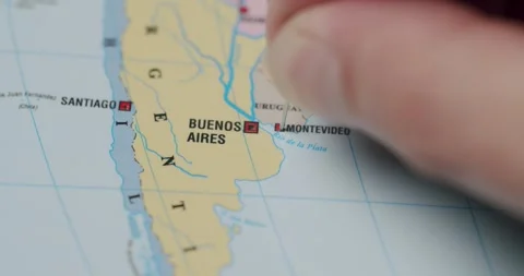 Marking Montevideo Uruguay on a world map with a push pin Stock Footage 345587277