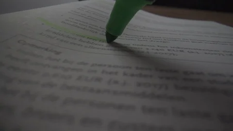 Marking phrase in book with green marker closeup POV Stock Footage 124015469