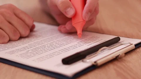 Marking text with orange marker Stock Footage 85167342