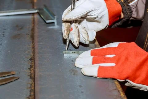 Marking tools. Markings on a metal surface for drilling holes. Using a corner Stock Photos