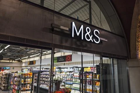 Marks and Spencer store front sign illuminated above entrance. London, UK, 29 Stock Photos
