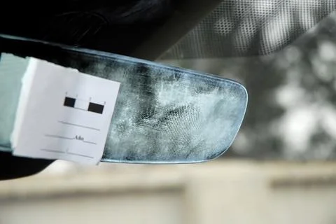 Marks and traces of gloves left by thieves on the rear view mirror Stock Photos
