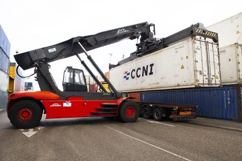 Marn-Spain Container truck picking up a container to be loaded onto a truck Stock Photos