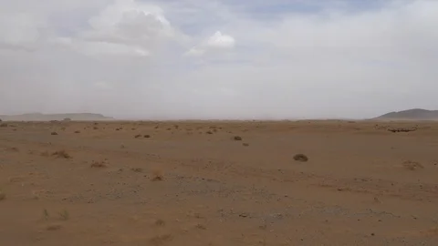 Maroccan arid landscape, mountain in background, cloudy day, Africa in 4K Stock Footage 92055837