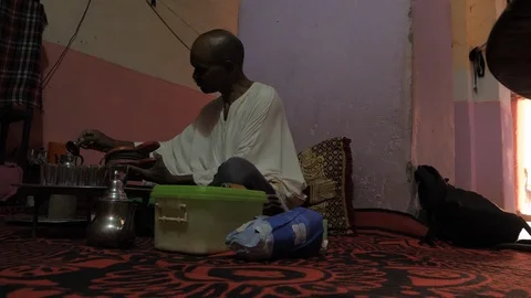 A Maroccan man prepares tea in his house, africa in 4K Stock Footage 92106421