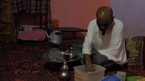 A Maroccan man prepares tea in his house, africa in 4K Stock Footage 92106657