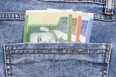 Marokkanischer Dirham in der Tasche einer Bluejeans Marokkanischer Dirham ... Stock Photos