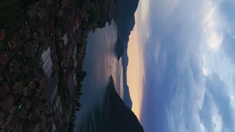 Marone on Lake Iseo at dramatic sunset, Italy. Aerial drone, vertical format Stock Footage 320386853