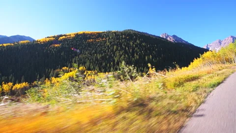 Maroon Bells car driving side pov in Colorado rocky mountains autumn Stock Footage 140403179