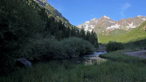 Maroon Bells panning panoramic view in Aspen, Colorado at sunny sunrise Stock Footage 120603909
