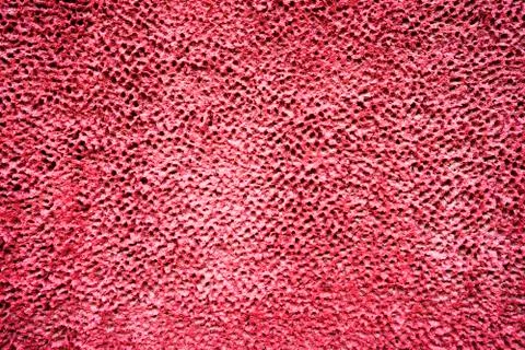 The maroon dilapidated cement wall texture. Dark pink stucco background. Abst Stock Photos