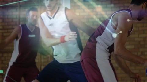 Maroon guard pivoting under press, driving, scoring as net overlaying players Stock Footage 328265921