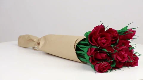 Maroon paper roses  Stock Footage 58563996