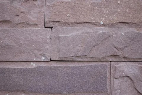 Maroon rectangular cut granite stones. Foto stock