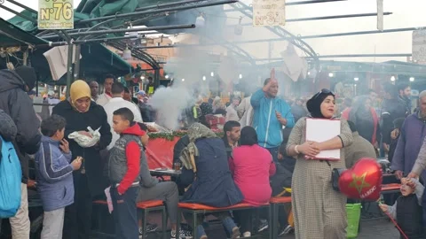 Marrakech, Marocco: The busy souk downtown with streetfood and smoke Stock Footage 229934552