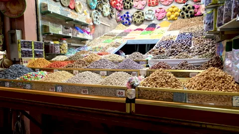 Marrakech, morocco. August 10, 2026. Colorful display of nuts, dried fruits, and Stock Footage 345239239