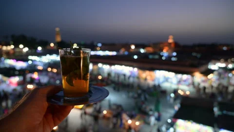 Marrakech, morocco. August 9, 2026. Hand holding a traditional moroccan mint tea Stock Footage 344838541