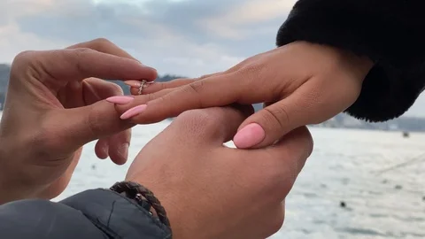 Marriage proposal and ring ceremony on the beach. Use for Valentine's Day Stock Footage