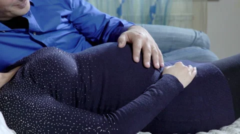 Married couple on a bed Stockbeeldmateriaal 59102764