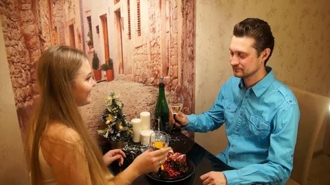Married couple clinking glasses. Romantic Christmas dinner. Happy couple. Stock Footage 82292238