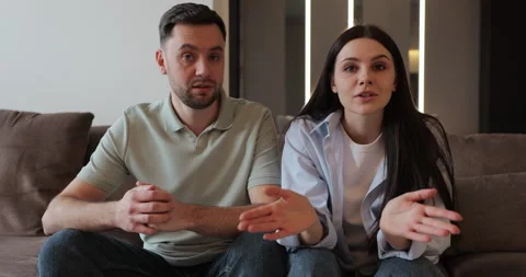 Married couple looking at the camera arguing and talking with psychotherapist Stock Footage 302269880