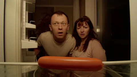 The married couple opens the refrigerator, it is almost empty Stock Footage 132290674
