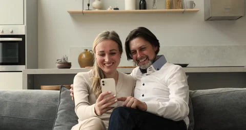 Married couple relax on sofa at home Stock Video Pond5