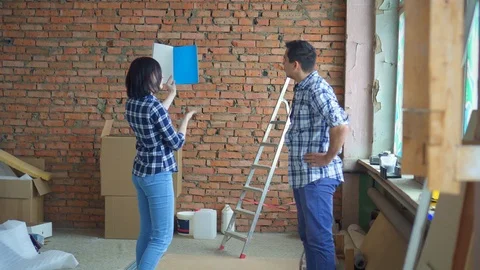 Married couple, repairs in their home, choose interior design color palette Stock Footage 99514838
