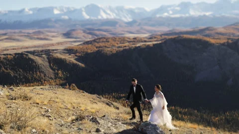 Married couple on top of the mountain. Video stock 274205033