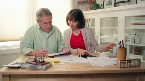 A married couple try to figure out how they are going to pay their bills Video stock 34012555