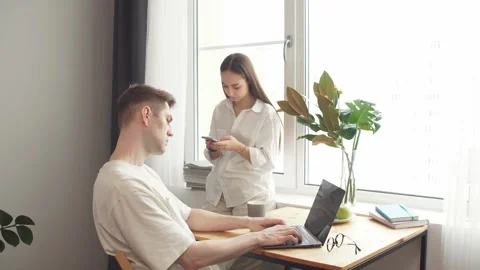 Married couple uses computer gadgets for business development. Stock Footage 133591500