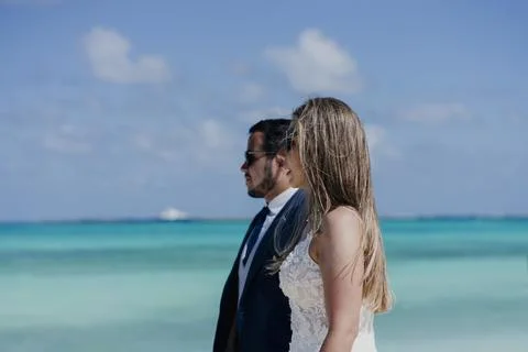 Married couple walking on the beach Stock Photos